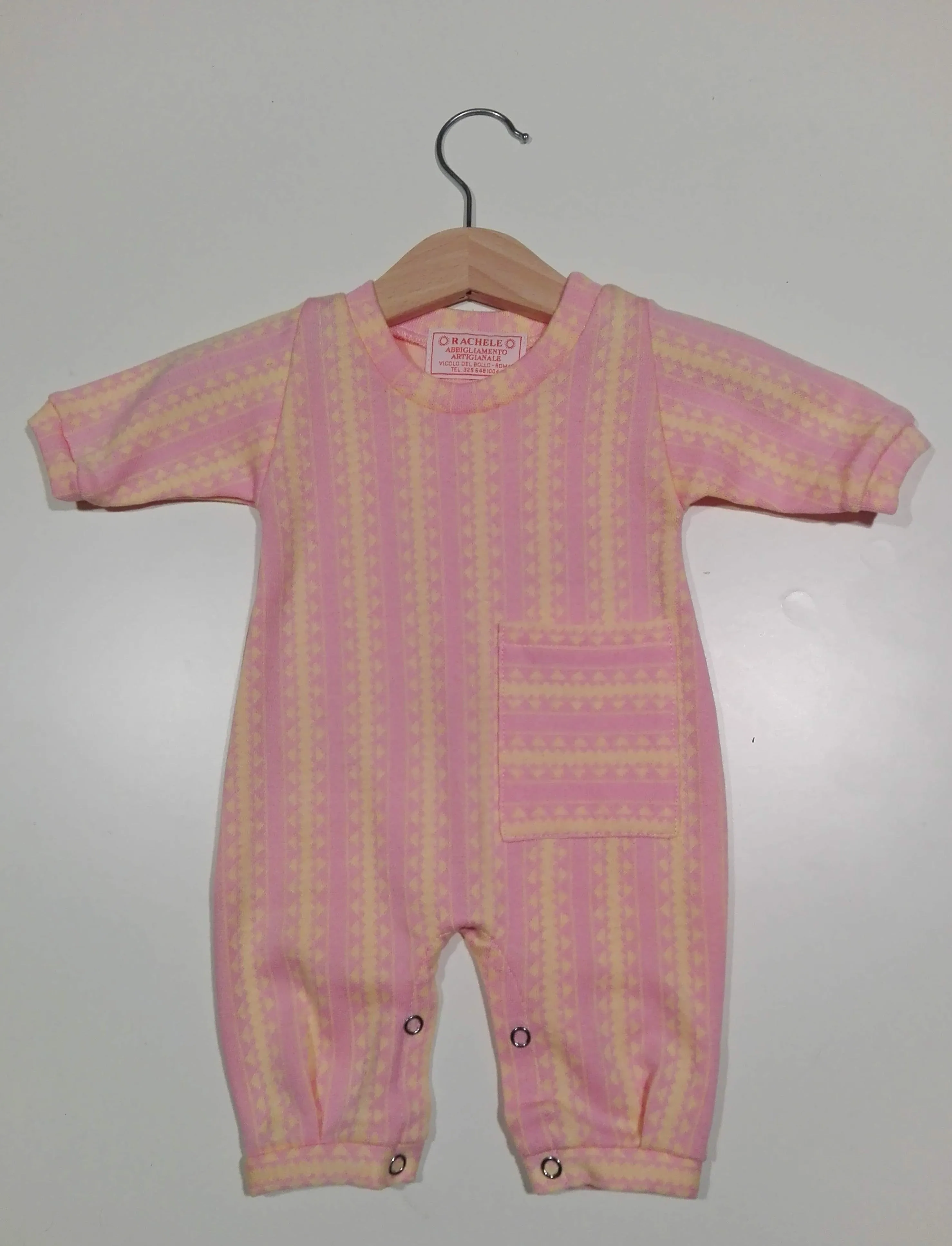 Onesie in warm cotton with cuffs and one pocket